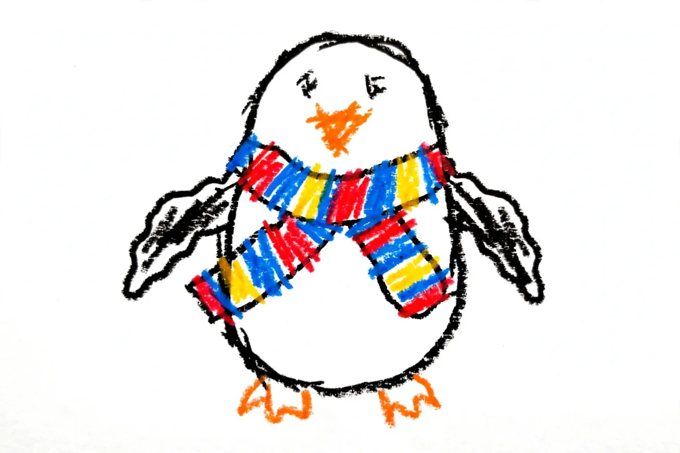 Rafi's marker drawing of a penguin in a red, blue and yellow striped scarf, used as the hero of his Christmas DoodleTale storybook