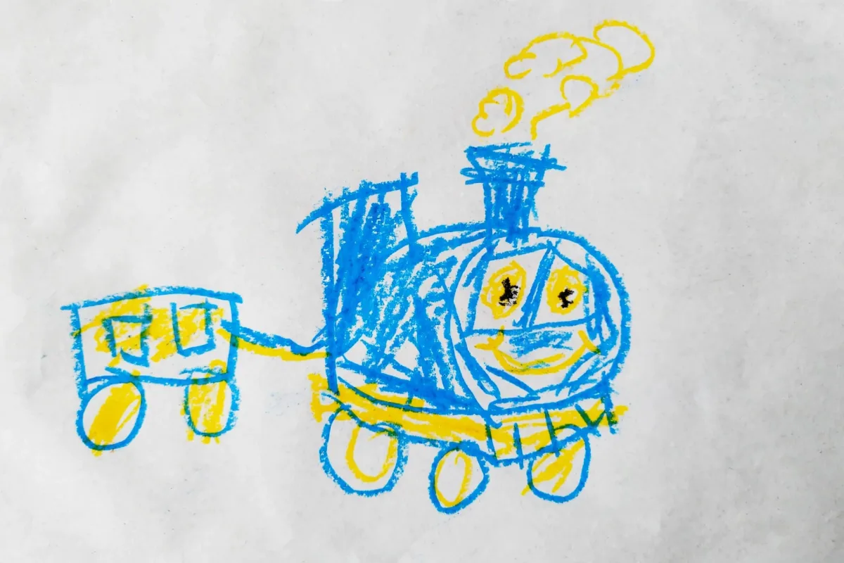 Willa's crayon drawing of a little train, used as the hero of her first day of school DoodleTale storybook