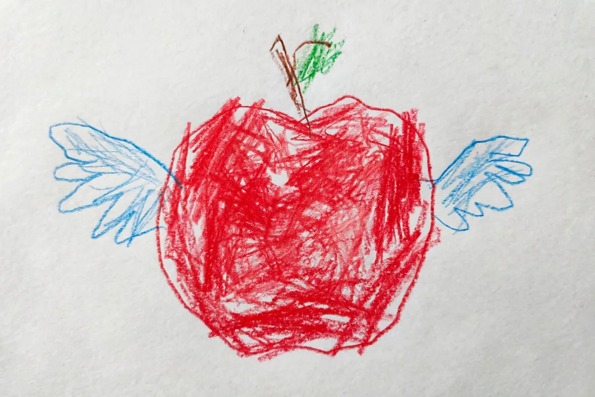 Elias's colored pencil drawing of a red apple with wings, turned into the hero of his Rosh Hashanah DoodleTale storybook