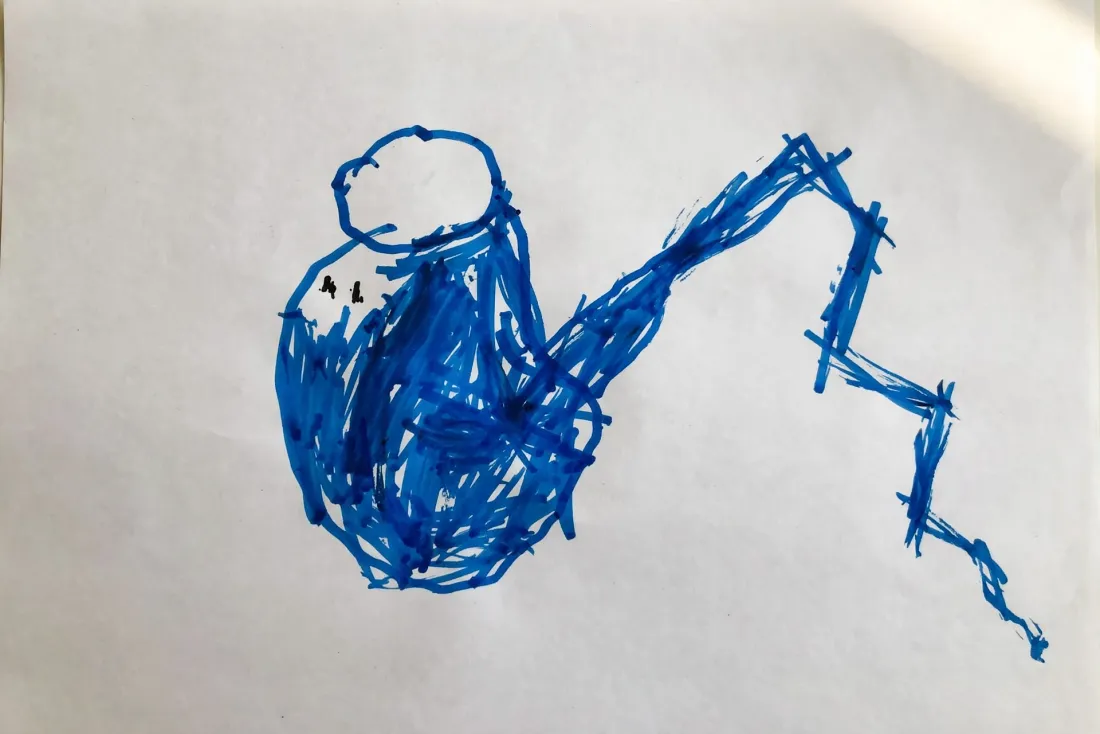 Tobias's marker drawing of a lopsided blue teapot with a very long crooked spout and two dot eyes, used as the hero of his DoodleTale storybook