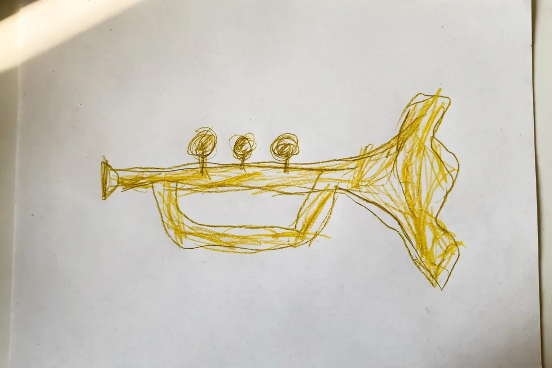 Emeka's colored pencil drawing of a small brass trumpet with three round buttons and a wide crooked bell, used as the hero of his DoodleTale storybook